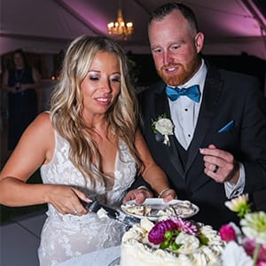Bride and groom cutting a cake